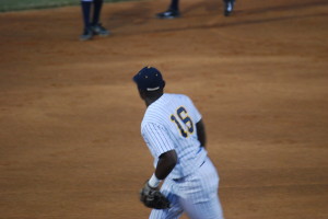 Mijon Cummings returns to third base after making a great defensive play in the fourth inning. Cummings drove in one of the two runs Tuesday night.
