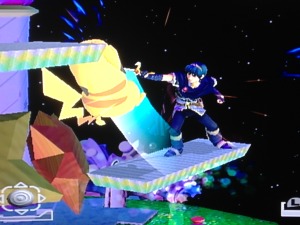 Marth attacking Pikachu on a stage's platform.