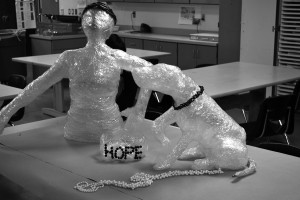 Art teacher Ellison Miller’s art club entered a sculpture into the local Doodad competition. This sculpture depicts a veteran with a service dog in order to support service dogs and right to bear arms.