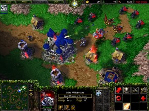 A screencap of Warcraft 3 during a battle.