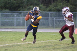 Jayquese Dantley breaks off for a run on the first play of the game.