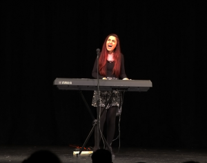 Lara Anid performing her song "The Tides".